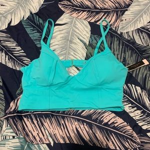 Victoria’s Secret longline bikini top. Teal, size large. New with tags